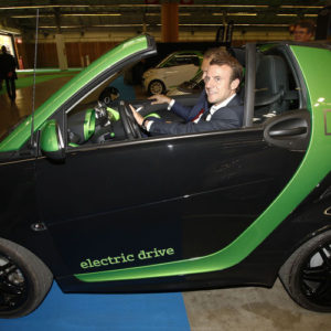 Mondial de l'automobile 2014. Porte de Versailles - Visite d'Emmanuel macron, ministre de l'économie et de l'industrie sur le stand du ministère de l’écologie afin de promouvoir les voitures électriques - France Paris le 04/10/2014